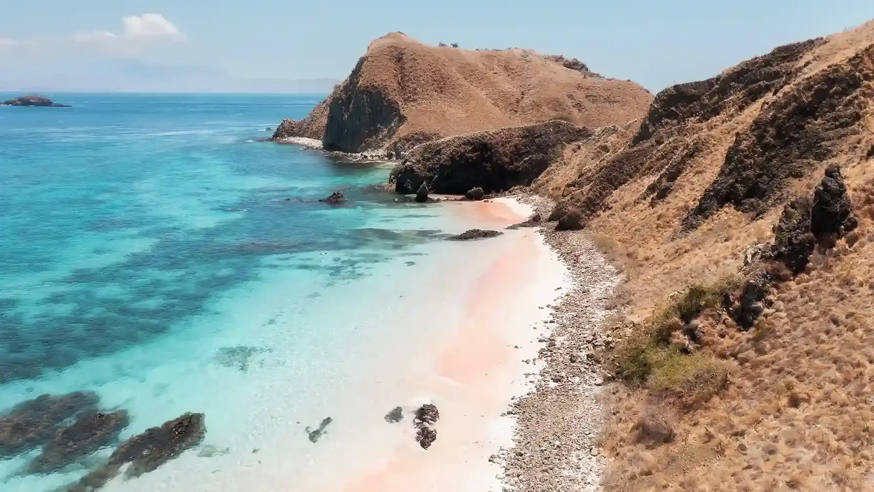 The pink sand and turquoise shallows of Pink Beach, Komodo